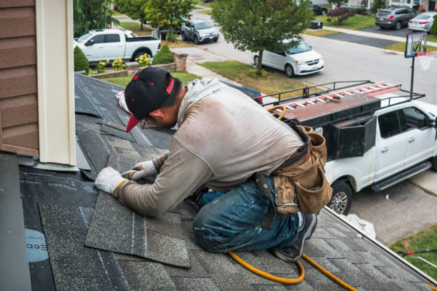 Professional Roofing technician working in Siletz, OR